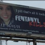 billboard with woman's face and fentanyl wanring