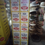 red and blue ads for commonly prescription drugs displayed at a Mexican pharmacy